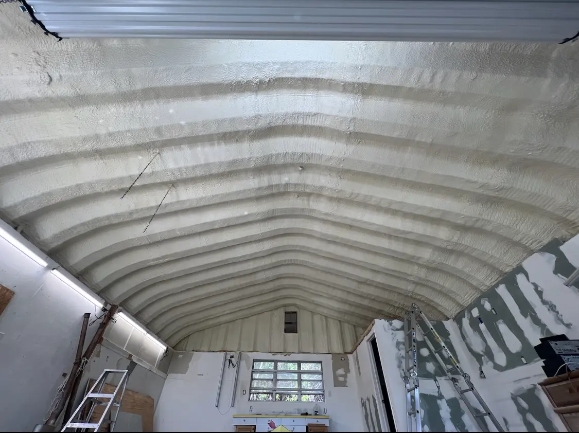 Spray polyurethane foam applied to the underside of a metal roof deck in Millcreek